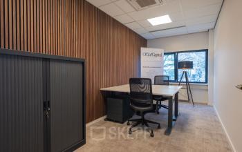 Modern office space at Horsterweg 24, Maastricht-Airport, featuring sleek wooden paneling, spacious desks, and ample natural light. Ideal for those seeking office space rental with a professional and contemporary vibe.