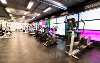 Modern gym area with various exercise equipment at Europalaan 24, Maastricht-Airport.