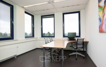 Office space rental at Europalaan 24, Maastricht-Airport with desks, chairs, and window views.