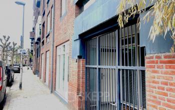 Exterior view of office to rent at Wilhelminasingel 44-46, Maastricht, showcasing brick facade and entrance.