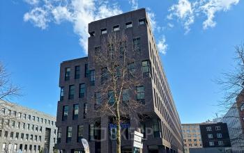 Exterior view of an office building at Robert Schumandomein 2, Maastricht, highlighting the modern structure suitable for office space rental.