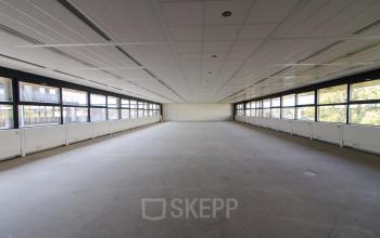 Spacious office space for rent with large windows and ample natural light at Boschstraat 21, Maastricht.