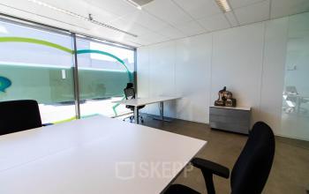 Bright office space available for rent at Brieltjenspolder 28, Made, featuring modern desks and ergonomic chairs in a well-lit environment.