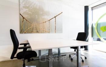Office to rent at Brieltjenspolder 28, Made, featuring a furnished workspace with two chairs around a white table, suitable for business activities.