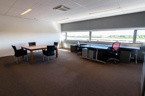 Bright office space for rent at Brieltjenspolder 28, Made, featuring desks and chairs, ideal for an office space rental.