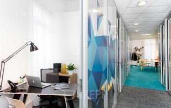 Modern and well-lit office space rental at Rue de la République 113, featuring sleek furnishings and vibrant accents in Marseille 2.