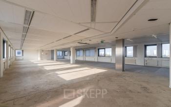 Expansive, unfurnished office space with large windows at Nevelgaarde 8-19, Nieuwegein, ideal for companies seeking office to rent and customize.