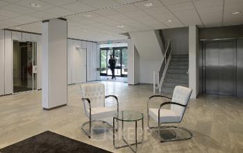 entrance building stairs white chairs table