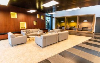 Modern furnished office space with cozy seating area, located at Jonkerbosplein 52 in Nijmegen. Ideal for office space rental.