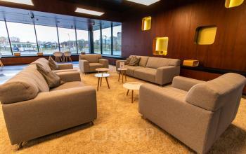 Modern lounge at Jonkerbosplein 52, Nijmegen with comfortable sofas and chic decor, perfect for office space rental needs.