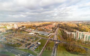 Aerial view of Jonkerbosplein 52 in Nijmegen, showcasing surrounding roads and parking areas.
