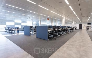 Spacious office space with rows of desks and chairs at Jonkerbosplein 52, ideal for those looking to rent office space in Nijmegen.