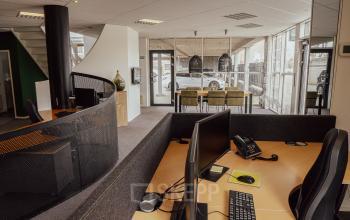 Spacious interior of an office to rent at Abdis van Thornstraat 74, Oosterhout Nb. Features modern workstations and ample natural light, ideal for productive office space rental.