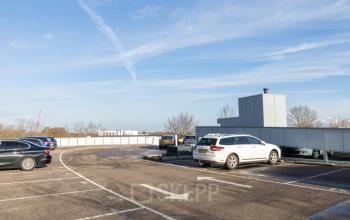 Parking area at Veengang 1, Oosterwolde, offering convenient access to rent office space in the building.