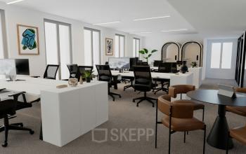 Espace de bureau à louer à Rue de la Victoire 10, Paris 9ème, spacieux et moderne avec des postes de travail, décorations murales et chaises confortables.