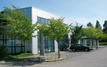 Exterior view of the office building located at Leeghwaterstraat 25, Reeuwijk with large windows and parking area.