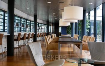 Spacious office space with modern furniture and large windows at Ericssonstraat 2, Rijen, Rijen available for office space rental.