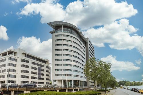 Exterior view of office building at Einsteinlaan 28, Rijswijk. Ideal for office space rental, offering modern architecture and convenient location.