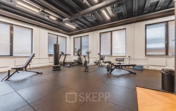 Spacious gym with exercise equipment at Lange Kleiweg 50-62 in Rijswijk, ideal for office space rental.