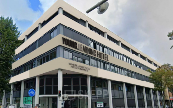 Exterior view of a multifunctional building at Volmerlaan 7, Rijswijk. The modern design offers potential for office to rent, with easy access and amenities.