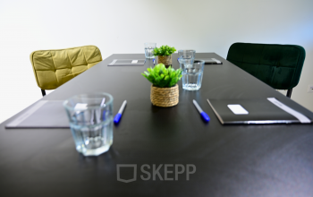 Furnished office space with a conference table and chairs, ready for meetings. Ideal choice for office space rental at Volmerlaan 7, Rijswijk.