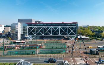 Exterior view of the office building at Generaal Eisenhowerplein 111 111, Rijswijk, showcasing modern architecture with a distinctive criss-cross design, ideal for office space rental.