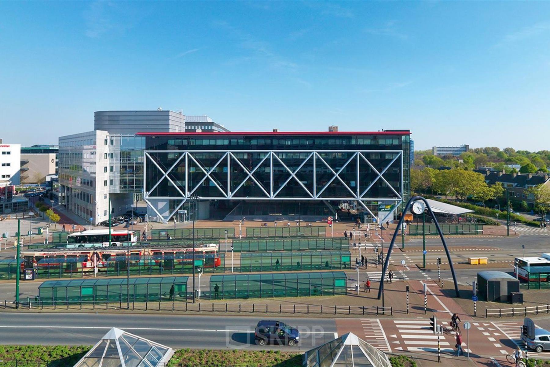 Exterior view of the office building at Generaal Eisenhowerplein 111 111, Rijswijk, showcasing modern architecture with a distinctive criss-cross design, ideal for office space rental.