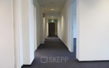 Hallway in an office building at JC van Markenlaan 3, Rijswijk, suitable for office space rental.