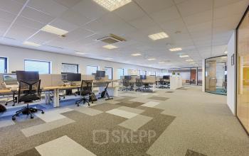 Spacious office area at Patrijsweg 4-140, Rijswijk, featuring numerous desks and ergonomic chairs, suitable for a modern workspace. Ideal office to rent for businesses needing ample room and collaborative environment.
