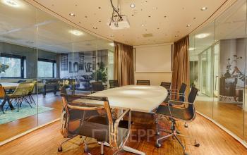 Spacious conference room with modern furniture and glass walls at Patrijsweg 4-140 in Rijswijk, ideal for office space rental.
