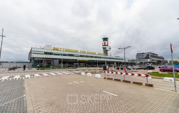 View of Rotterdam Airport at Airportplein 22, showing parking areas and office space rental options nearby.