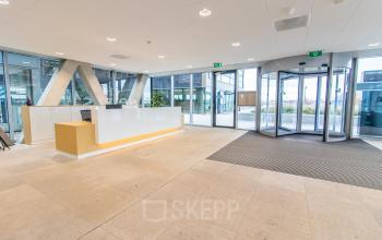 Spacious reception area at Rotterdam Airport with modern design, ideal for anyone looking to rent office space or explore office space rental options.