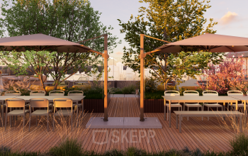 Open rooftop area at Marten Meesweg 101 in Rotterdam Alexander, featuring wooden decking, tables, chairs, and umbrellas, perfect for an office space rental. There are no people visible.