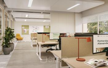 Modern office space for rent at Marten Meesweg 101, Rotterdam Alexander with workstations, computers, and natural light streaming through large windows.