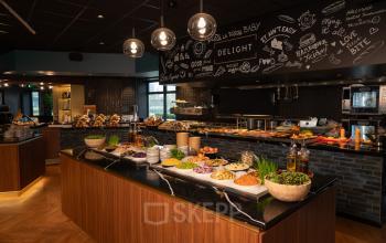 A well-equipped office pantry at George Hintzenweg 77 - 89, Rotterdam Alexander, offering a vibrant display of snacks and beverages, ideal for office space rental needs.