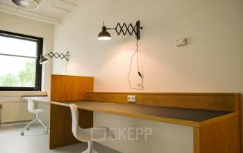 Modern furnished workspace with two desks and chairs at Marten Meesweg 8-10 in Rotterdam Alexander, available for office space rental.