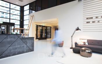 Modern office space with reception area, seating, and contemporary decor in Marten Meesweg 8-10, Rotterdam Alexander.