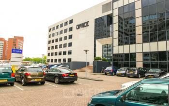 Exterior view of office building at Marten Meesweg 8-10, Rotterdam Alexander, with parking space in front.