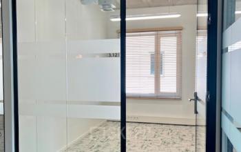 Unfurnished office space available for rent at Bahialaan 100, Rotterdam Brainpark, featuring large windows and modern design.