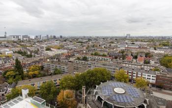 Panoramic view of Rotterdam Central Station area from Weena 750, highlighting the city's diverse architecture and urban landscape.