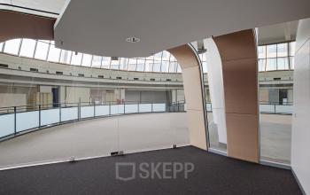 Interior view of furnished office space at Kruisplein 15-25, Rotterdam Central Station, featuring sleek modern design elements and ample natural light.