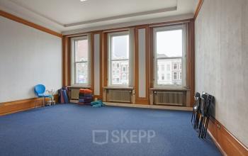 Spacious office space rental at Schiekade 830 with large windows and ample natural light in Rotterdam Center.