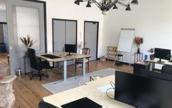 Office space rental at Schiekade 105, Rotterdam Center with modern desks, computers, and a whiteboard.