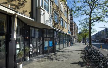 Exterior view of office building located at Nieuwe Binnenweg 75-77, Rotterdam Center, featuring rental office spaces with a street-side setting.