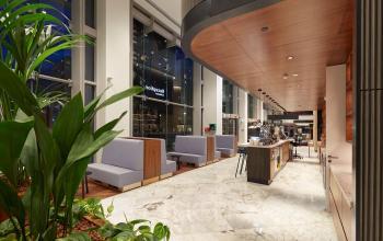 Spacious office at Blaak 555, Rotterdam Center, featuring modern furnishings and a well-lit open floorplan. Ideal for office space rental seekers.