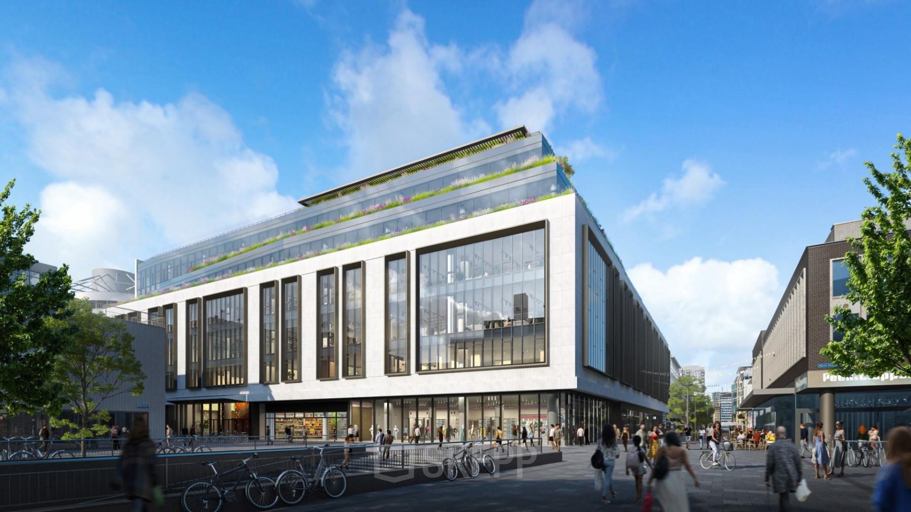 Exterior view of a modern office building at Hoogstraat 185 in Rotterdam Center, ideal for office space rental with sleek architecture and large windows. People walk by the building, adding vibrant activity.