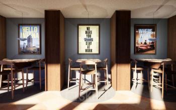 Chic lounge area at Coolsingel 139, Rotterdam Center, featuring stylish seating and framed motivational posters, ideal for office space rental.