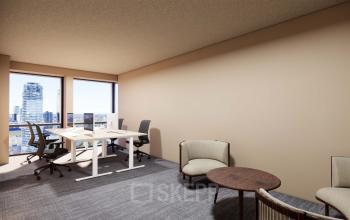 Bright office space located at Coolsingel 139 in Rotterdam Center, featuring modern furniture and panoramic city views, ideal for workspace rental.