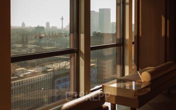 Office at Coolsingel 139 in Rotterdam Center offers expansive windows with city views, ideal for office space rental.