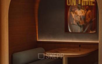 Cozy office space at Coolsingel 139 in Rotterdam Center featuring a furnished booth with seating and a table for informal meetings.